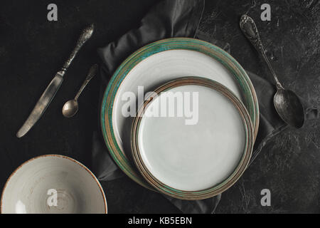 ceramic plates and silverware Stock Photo