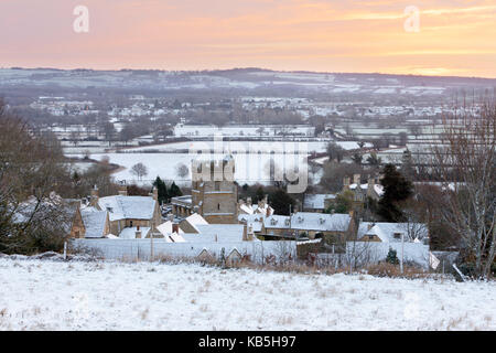 Cotswold village and landscape in snow at sunrise, Bourton-on-the-Hill, Cotswolds, Gloucestershire, England, United Kingdom Stock Photo