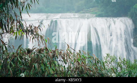 Anshun, Anshun, China. 28th Sep, 2017. Anshun, CHINA-September 2017:(EDITORIAL USE ONLY. CHINA OUT) Scenery of the Huangguoshu Waterfall Scenic Area in Anshun, southwest China's Guizhou Province. The Huangguoshu Waterfall, the largest waterfall in China and one of the most famous in the world, is the only waterfall on the planet that can be viewed from above, below, front, behind, left and right. It is 77.8 meters high and 101 meters wide. The main waterfall is 67 meters high and 83.3 meters wide. Water Curtain Cave, a 134-meter natural corridor behind the waterfall, allows visitors to wa Stock Photo