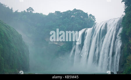 Anshun, Anshun, China. 28th Sep, 2017. Anshun, CHINA-September 2017:(EDITORIAL USE ONLY. CHINA OUT) Scenery of the Huangguoshu Waterfall Scenic Area in Anshun, southwest China's Guizhou Province. The Huangguoshu Waterfall, the largest waterfall in China and one of the most famous in the world, is the only waterfall on the planet that can be viewed from above, below, front, behind, left and right. It is 77.8 meters high and 101 meters wide. The main waterfall is 67 meters high and 83.3 meters wide. Water Curtain Cave, a 134-meter natural corridor behind the waterfall, allows visitors to wa Stock Photo