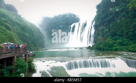 Anshun, Anshun, China. 28th Sep, 2017. Anshun, CHINA-September 2017:(EDITORIAL USE ONLY. CHINA OUT) Scenery of the Huangguoshu Waterfall Scenic Area in Anshun, southwest China's Guizhou Province. The Huangguoshu Waterfall, the largest waterfall in China and one of the most famous in the world, is the only waterfall on the planet that can be viewed from above, below, front, behind, left and right. It is 77.8 meters high and 101 meters wide. The main waterfall is 67 meters high and 83.3 meters wide. Water Curtain Cave, a 134-meter natural corridor behind the waterfall, allows visitors to wa Stock Photo