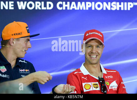 Sepang, Sept. 28. 1st Oct, 2017. Germany's Formula One driver Sebastian Vettel (R) of Ferrari and Dutch Formula One driver Max Verstappen of Red Bull Racing react during a press conference ahead of 2017 Malaysia Formula One Grand Prix at the Sepang Circuit in Malaysia, on Sept. 28, 2017. 2017 Malaysia Formula One Grand Prix will kick off on Oct. 1, 2017. Credit: Chong Voon Chung/Xinhua/Alamy Live News Stock Photo