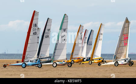 Hoylake, The Wirral, UK. 28th Sep, 2017. The European Sand Yacht Championships in conditions of low winds on the coast. Class2 & Class 3 yachts compete in the International events. Competitors competed in a series of races in varying wind and beach conditions culminating in the award of the accolade of European Champion in each of the 3 sand yacht classes. Credit: MediaWorldImages/Alamy Live News Stock Photo
