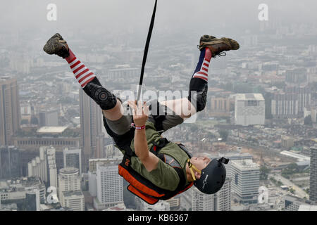 Kuala Lumpur, MALAYSIA. 29th Sep, 2017. Base jumpers leaps from the 300-metre high open deck at Kuala Lumpur Tower during the Kuala Lumpur Tower Jump 2017 on Friday, September 29 in Kuala Lumpur, Malaysia. 120 professional base jumpers from 24 countries.The event will take event from 30th September to 2nd October. Credit: ZUMA Press, Inc./Alamy Live News
