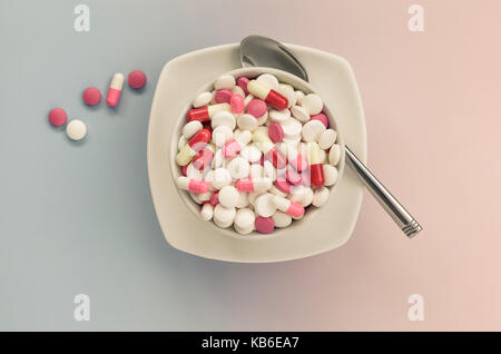 Mixed painkillers ,pills in white bowl Stock Photo