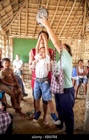 Mindoro is an island in the west of the Philippines. The indigenous peoples of the province are the Mangyans, they live off civilization areas and avoid contact with other islanders. Only the German Doctors come regularly and provide medical assistance. Ap | usage worldwide Stock Photo