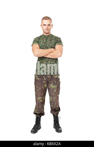 Full length portrait of serious army soldier with his arms crossed isolated on white background Stock Photo