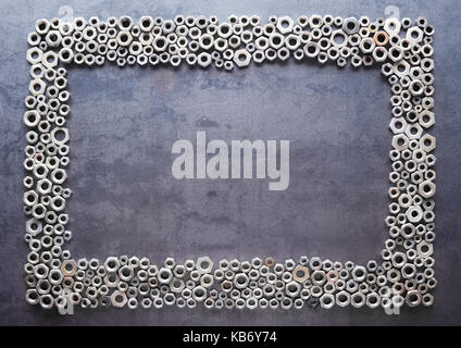 assorted nuts frame on metal texture background Stock Photo