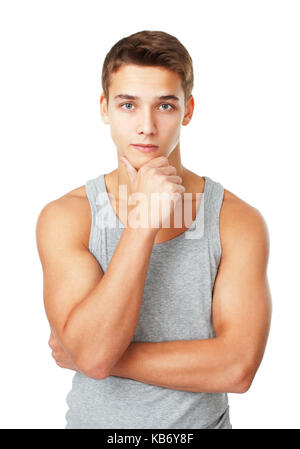 Portrait of young man wearing a gray T-shirt  isolated on white background Stock Photo