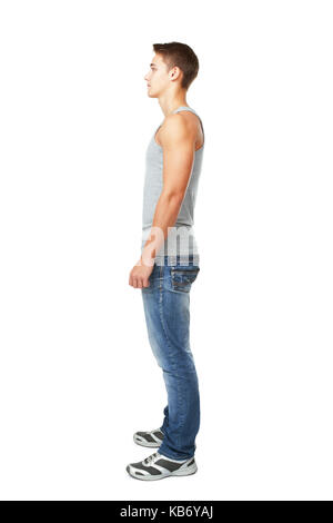 Full length side view portrait of young man isolated on white background Stock Photo