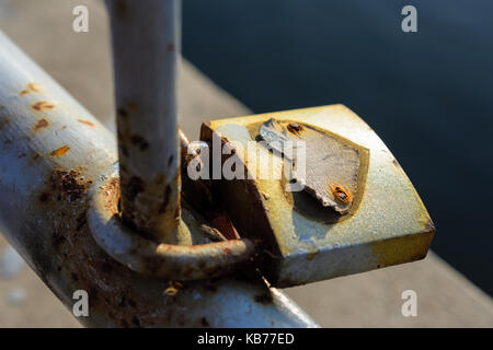 Close-Up Of Beautiful And Romantic Love Lock With Heart Symbol On Bridge During Sunset Stock Photo