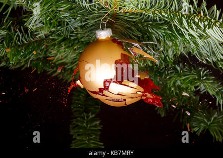 Bauble on a Christmas tree exploding Stock Photo