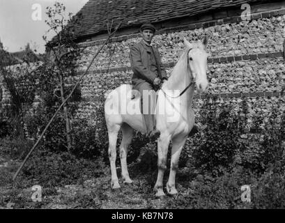 AJAXNETPHOTO. 1890 - 1914 (APPROX). LOCATION UNKNOWN. - WELL DRESSED MAN ON A WHITE HORSE POSING FOR THE CAMERA IN FRONT OF A STONE BUILT BUILDING. PHOTOGRAPHER:UNKNOWN © DIGITAL IMAGE COPYRIGHT AJAX VINTAGE PICTURE LIBRARY SOURCE: AJAX VINTAGE PICTURE LIBRARY COLLECTION REF:AVL 172109 7 Stock Photo