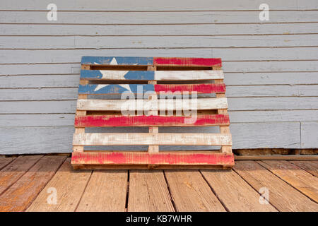 Patriotic art in the form of a wooden pallet painted to represent the flag of the United States. Stock Photo