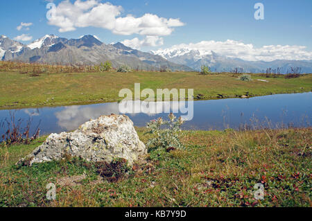 Mountain lakes reflecting tops of Ushba in Mestia, Georgia Stock Photo