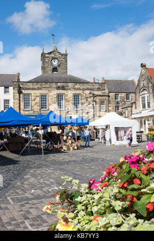 Market stalls at Alnwick weekly market, Northumberland, England Stock Photo