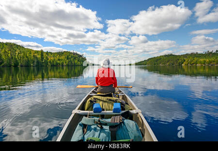 Canoer on Kekekabic Lake in the Boundary Waters in Minnesota Stock Photo