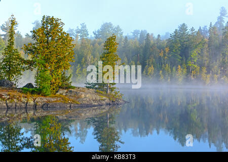 Fog and Mist on Ottertrack Lake in the Boundary Waters in Early Morning Stock Photo