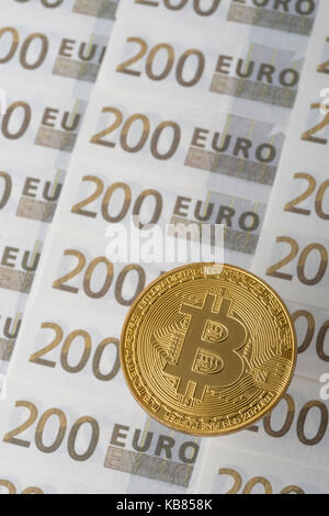 Gold Bitcoin on 200 Euro banknote. For European Digital Single Market, Bitcoin-Euro exchange rate, EU e-commerce, EU Bitcoin regulation, Bitcoin surge Stock Photo