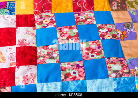 garment industry, needlework, homemade, quilting, interior, design concept - masterpiece of sewing made of colorful textile scraps in geometric forms  Stock Photo