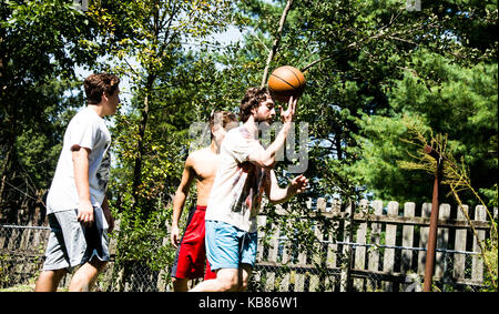 Brothers Playing Basketball Stock Photo