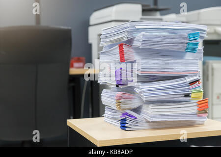 Business and finance concept of office working, Pile of unfinished documents on office desk, Stack of business paper Stock Photo