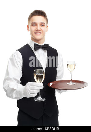 Portrait of young happy smiling waiter holding glasses of white wine isolated on white background Stock Photo