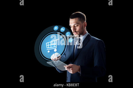 businessman with tablet pc and virtual shopping Stock Photo