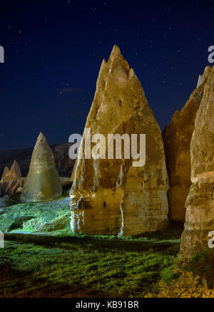 Typical fairy chimneys, eroded sandstone rock formations in Göreme at night. Cappadocia. Central Anatolia. Turkey Stock Photo