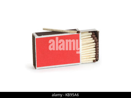 One match lying on red open matchbox on white background. Isolated with clipping path Stock Photo