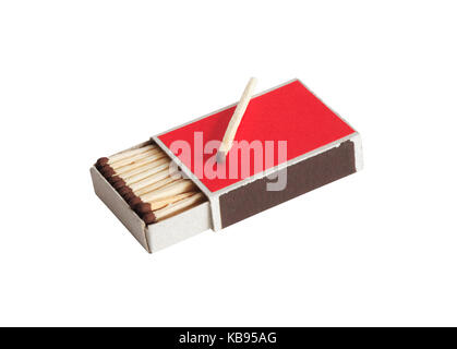 One match lying on open red matchbox. Isolated on white with clipping path Stock Photo