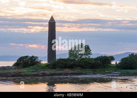 The old Pencil memorial at largs to comemorate the battle of Largs in 1263 taken on a gentle sunset in June. Stock Photo