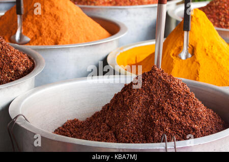 Super Spicy Indian Spices and a colorful foods display at a street stall on the city streets of India. Piles of organic food heaped into cones Stock Photo