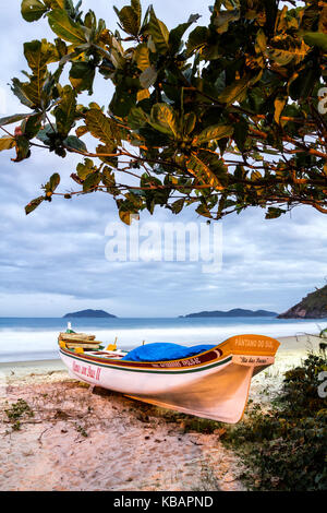 Boat on the sand at Solidao Beach at dusk. Florianopolis, Santa Catarina, Brazil. Stock Photo