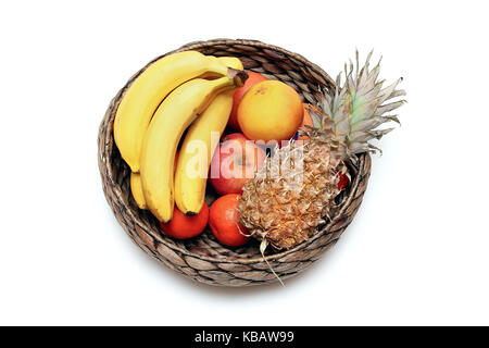Fresh fruits in rattan basket on white background Stock Photo