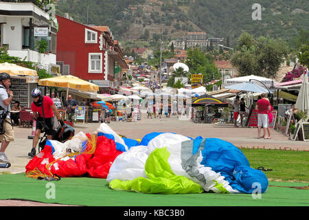 Parachutes in Olu Deniz town, Turkey Stock Photo