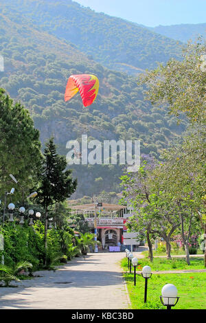 Para-gliders landing in Olu Deniz beach, Turkey Stock Photo