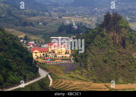 Buildings between three mountains (aka Tam Son), Quan Ba, Ha Giang, Vietnam. Ha Giang in northern Vietnam is the less frequented by tourists. Stock Photo