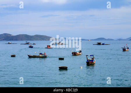 A dock in Nha Trang beach, Vietnam. Nha Trang is well known for its beaches and scuba diving and has developed into a destination for international to Stock Photo