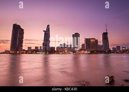 Downtown Saigon in twilight (view from Thu Thiem district), Ho Chi Minh city, Vietnam. Saigon is the largest city and economic center in Vietnam Stock Photo