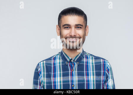 Happiness bearded businessman smiling into camera. Businessman with beard grinning having positive look. Studio shot Stock Photo