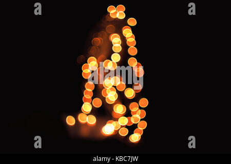Abstract Close-Up Of Defocused Orange Christmas Lights Taken With Helios 44-2 Vintage Lens During Night Stock Photo