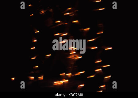 Abstract Close-Up Of Minus Symbol Shaped Bokeh Of Orange Christmas Lights Taken With Helios 44-2 Vintage Lens During Night Stock Photo