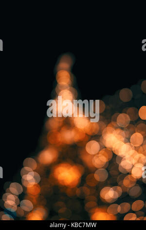 Abstract Close-Up Of Defocused Lights On Christmas Tree During Night