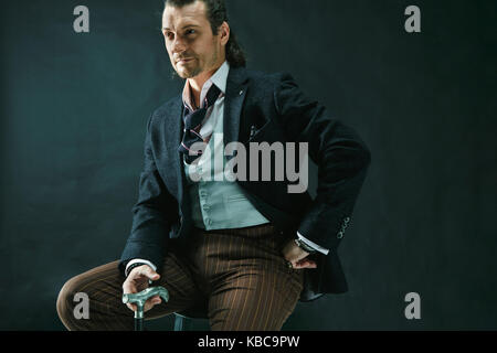 Businessman sitting on an armchair Stock Photo