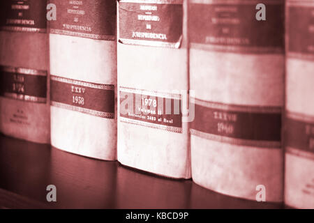 Old legal books law reports on shelves of law offices of attorneys and lawyers in judicial reference library.