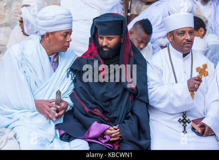 Ethiopian Orthodox worshipers waiting for the Holy fire ceremony to begin at the Ethiopian section of the Holy Sepulcher in Jerusalm Israel Stock Photo