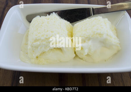 traditional balkan breakfast set kaymak or butter cream flatbread and on a white ceramic Stock Photo