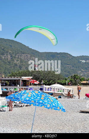 para-gliders landing on Olu Deniz Belcekiz Beach, Turkey Stock Photo