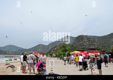 Holidaymakers and para-gliders on Olu Deniz Belcekiz Beach, Turkey Stock Photo